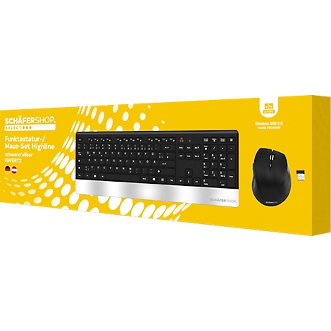 Un ensemble clavier-souris noir, emballé dans une boîte jaune. Le clavier a une barre argentée. Une souris est située à droite.