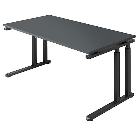 A grey desk with black legs. It is photographed at a slight angle from above.