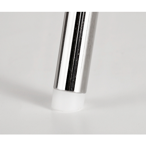 Close-up of a metallic tube with a white rubber buffer. The surface reflects the light.