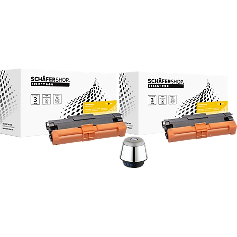 Twee zwarte en oranje tonercartridges naast een ronde grijze basis en twee dozen van Schäfershop.