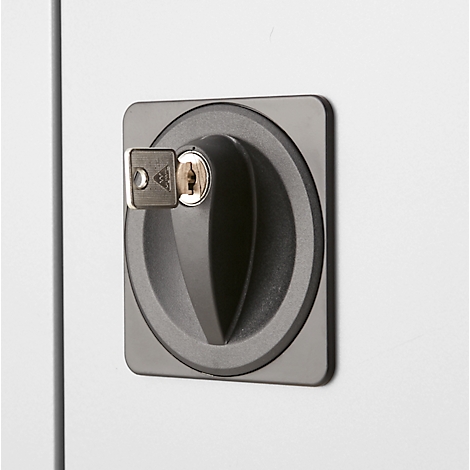 Close-up of a cabinet lock with a key.