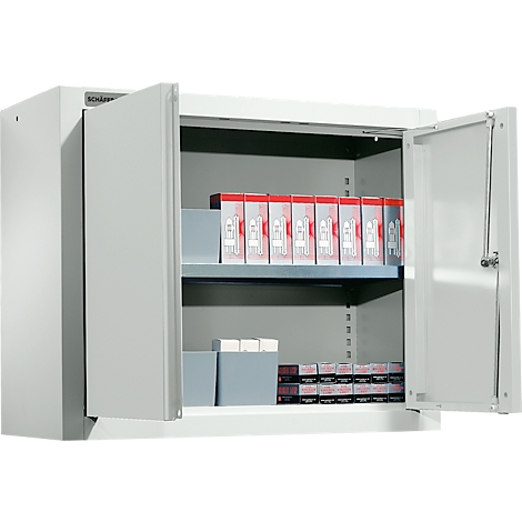 Open gray steel cabinet with two shelves filled with products. The name "Schäfer" can be seen at the top left.