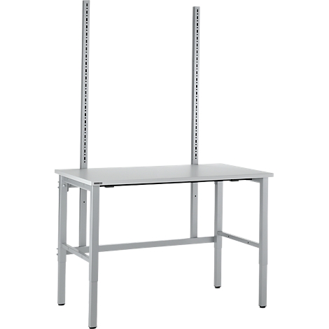 A grey workbench with two vertical holders. The table legs are height adjustable.