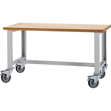 Wooden table with castors. A wooden top, and a gray metal frame with four castors.
