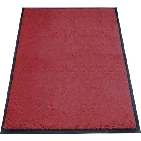 Ein roter Teppich mit schwarzem Rand. Die Oberfläche ist weich und strukturiert.