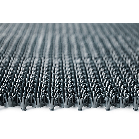 Nahaufnahme einer grauen Kunststoffmatte mit vielen kleinen, spitzen, blütenförmigen Lamellen.