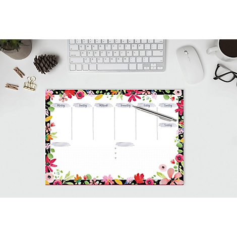 Blumenmuster Wochenplaner mit Wochennamen. Stift liegt auf dem Papier. Tastatur, Maus und Brille im Hintergrund.