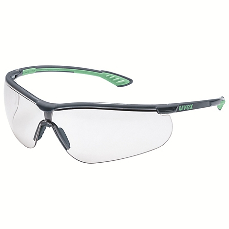 Graue Schutzbrille mit grünen Akzenten und Uvex-Schriftzug, klare Gläser.