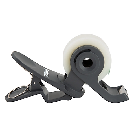 Gray tape dispenser with clip and roll of tape. Imprint: Scotch.