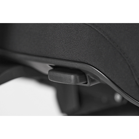 Detailed view of a black product. A button is located on a curved housing.