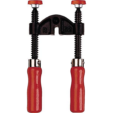 Serre-joint noir avec poignée rouge et capuchon à vis rouge. Le cadre porte la mention "R 52".