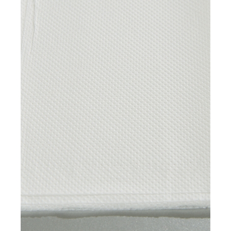 Gros plan d'un tissu blanc texturé avec un motif en nid d'abeille.