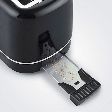 Close-up of a black toaster. The crumb tray is pulled out and filled with crumbs.