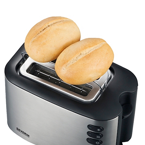 Zwei Brötchen auf einem Toaster aus gebürstetem Metall. Der Toaster ist eingeschaltet.