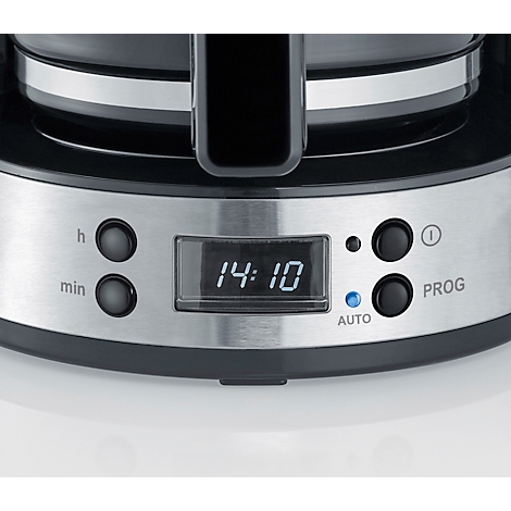 Detailansicht einer Kaffeemaschine mit Digitaluhr, die 14:10 anzeigt. Es gibt Tasten für Stunden, Minuten, Programm und Automatik.