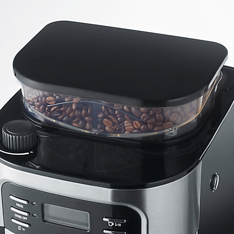 Nahaufnahme einer Kaffeemaschine, die Kaffeebohnen in einem transparenten Behälter zeigt.