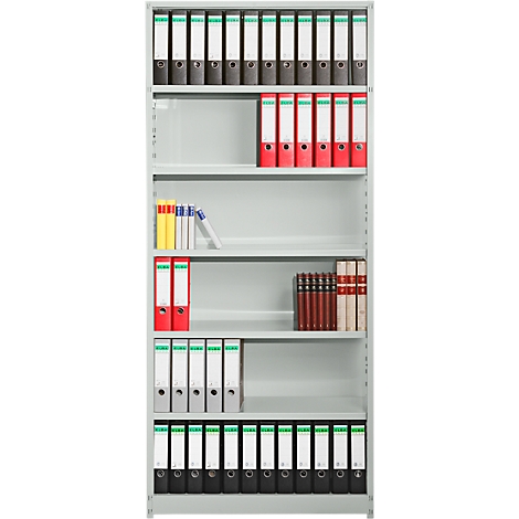 Grey shelving unit filled with files, books, and loose paper. Some files are red, others black or white with green or white labels.