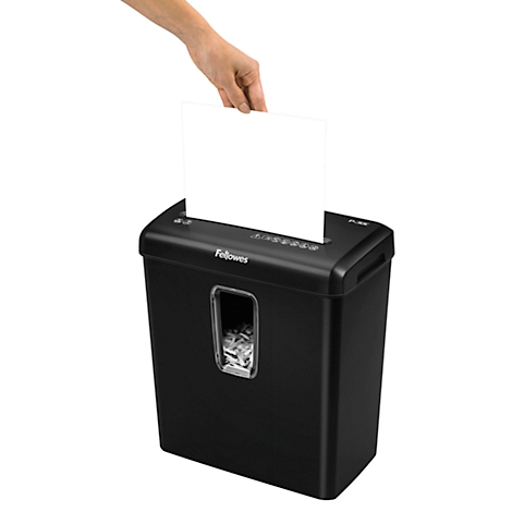 Person inserting paper into a black shredder. Fellowes logo is visible.