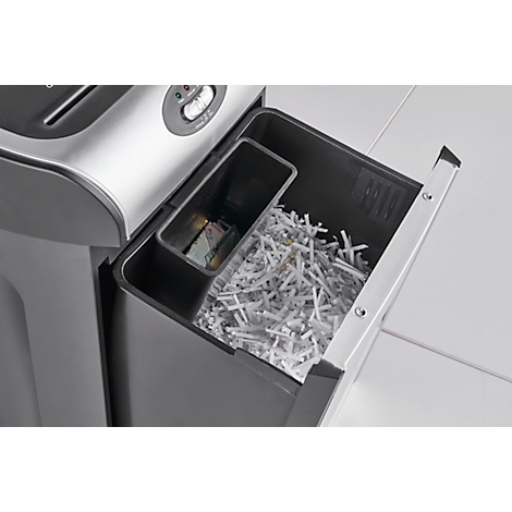 Shredder with pulled-out drawer filled with shredded paper and a small wastebasket.