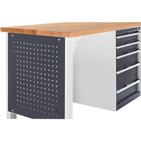 Workbench with wooden top and drawers. Side panel with holes. Drawers with metal handles.