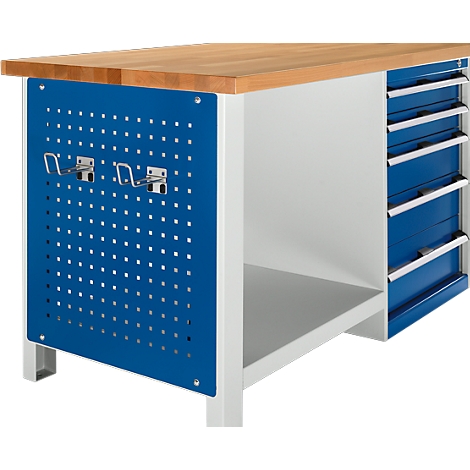 Workbench with wooden top, blue perforated sheet and drawers. Hooks are attached to the perforated sheet.