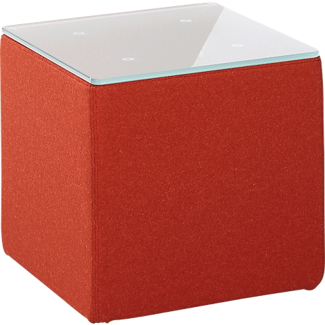 A square stool with a red fabric cover and a glass top.