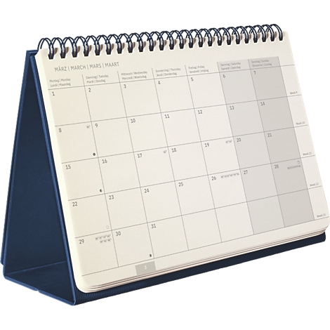Aufgestellter Tischkalender mit Ringbuchbindung, zeigt den Monat März auf hellem Papier mit dunkelblauem Fuss.