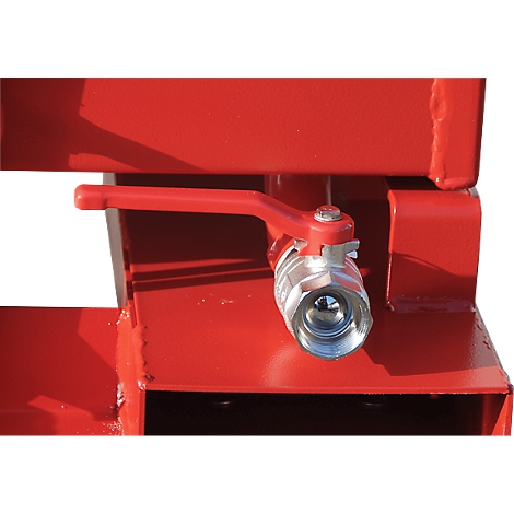 Detailed shot of a red valve with a silver ball valve on a red steel structure.