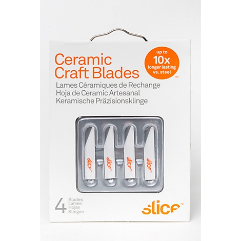 White ceramic craft blades in packaging, "Slice" logo. Inscription: Up to 10x longer lasting vs. steel.