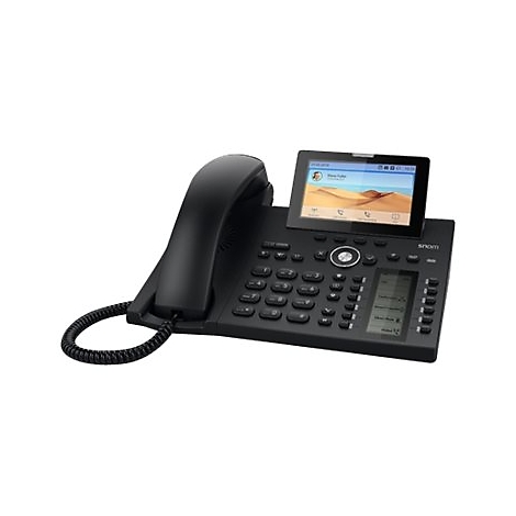 Téléphone de bureau noir avec écran, combiné et clavier. Un paysage désertique sur l'écran.