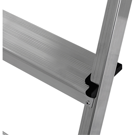 Detail of a silver stepladder; the step is ribbed, a black spacer and a rivet are visible.