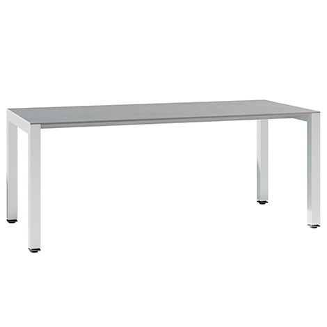 A rectangular table with a grey, smooth top and silver legs. The legs are placed at the corners of the table.
