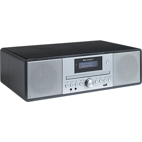 Un système de musique noir. L'écran affiche 'Bluetooth connecté'. Commandes argentées et grilles de haut-parleurs.