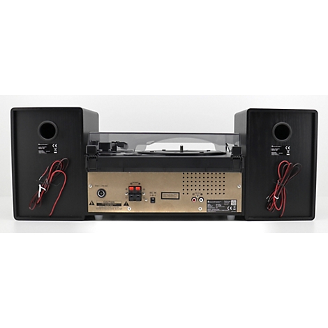 Nahaufnahme einer Stereoanlage mit Plattenspieler und Lautsprechern. Die Rückseite der Anlage zeigt Anschlüsse.