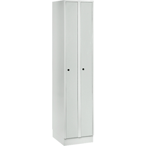 White tall cabinet with two doors, two black handles, and a base. The doors have vertical, slightly raised stripes.
