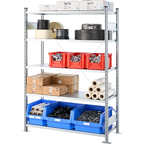 Shelving unit with various stored materials: rolls, boxes, crates.