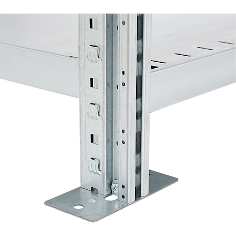 Detail shot of a metal shelving construction. The focus is on the corner pillar with its rectangular recesses and the base plate.