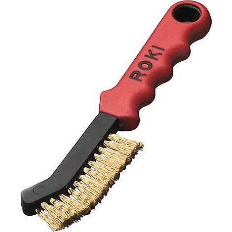 Draadborstel met een rode handgreep, gemarkeerd "ROKI". Zwarte borstelkop met gouden borstelharen. De handgreep heeft een oogje.