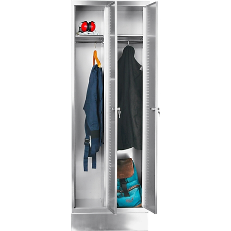 An open, silver cabinet with clothes and a backpack. The cabinet is divided into three compartments containing clothes, a backpack and hearing protection.