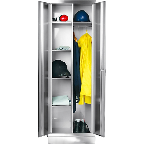 An open steel cabinet containing work clothes and helmets.