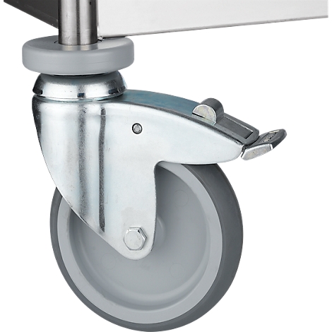 Close-up of a caster wheel with brake, mounted under a metal plate.