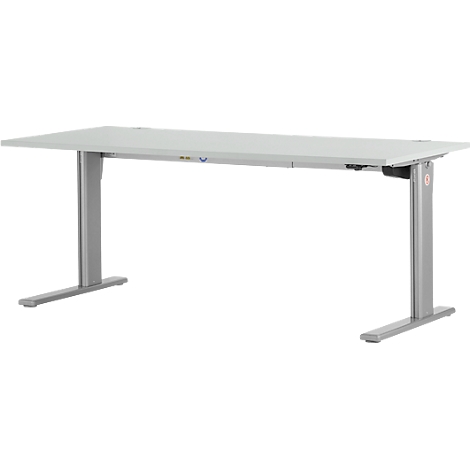 Een witte in hoogte verstelbare bureau tegen een witte achtergrond.