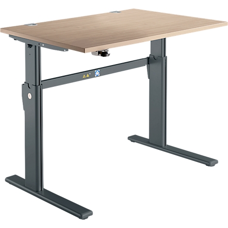 A height-adjustable desk with a light brown tabletop and a gray frame. The legs are U-shaped.