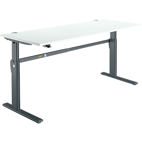 A white, height-adjustable desk against a white background. Dark gray frame, angular table legs.