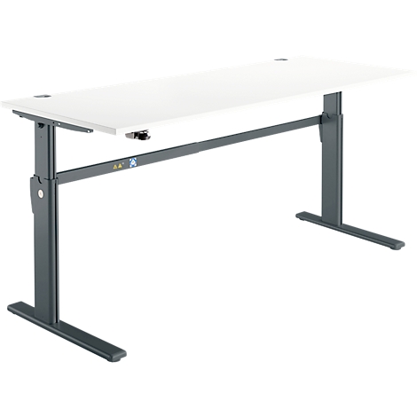 An adjustable height desk. The light-colored tabletop is supported by a dark-colored frame.