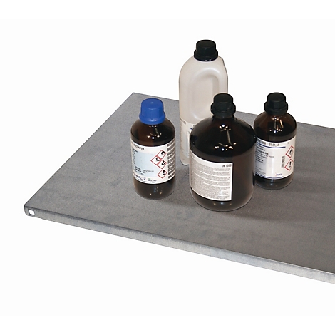Four bottles with liquids are on a metal plate. Hazard symbols are visible on the bottles.