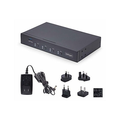 Commutateur noir avec port USB, alimentation et diverses prises sur fond blanc.