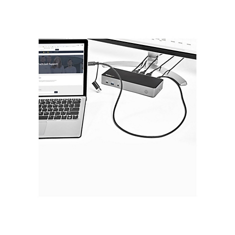 Ordinateur portable connectÃ© Ã  un moniteur via une station d'accueil. CÃ¢ble en forme de boucle.