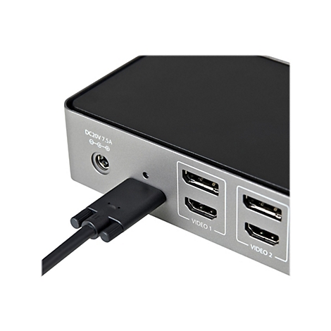 Gros plan d'un appareil HDMI avec un cÃ¢ble branchÃ© et des ports.