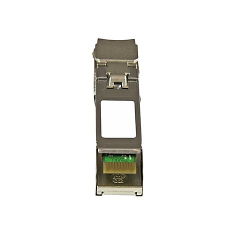 Module rÃ©seau argentÃ© avec connecteur vert, gros plan.